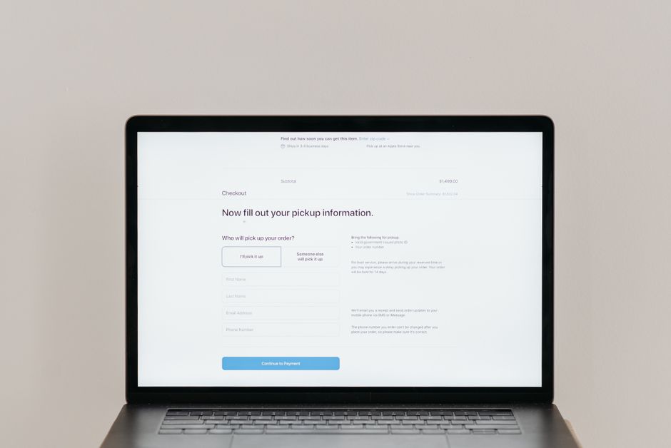 Person shopping online on a laptop, representing a digital product listing and checkout