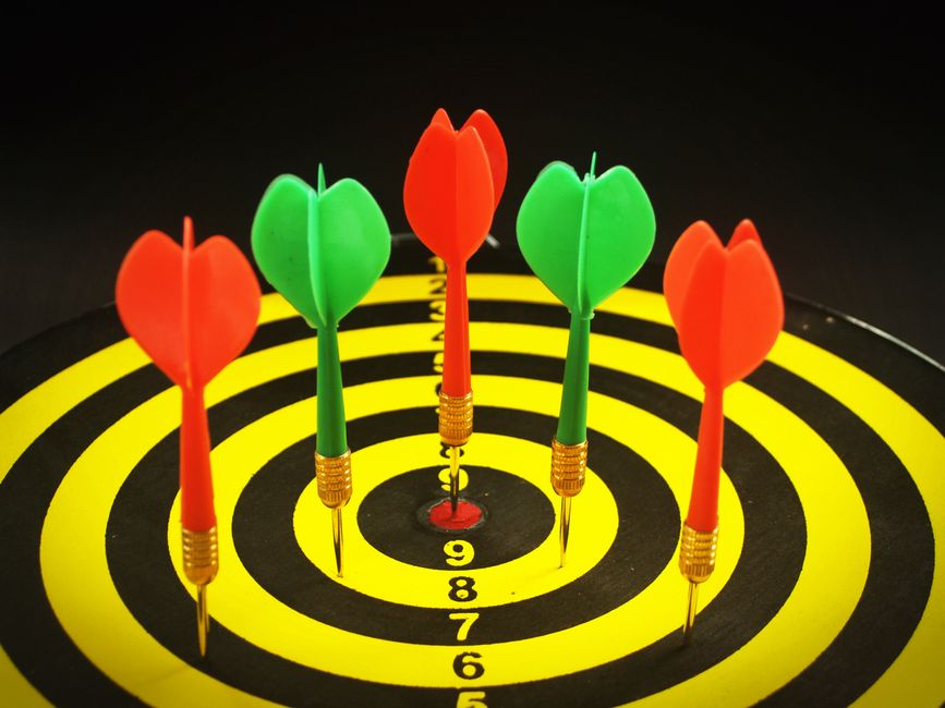 Dart hitting a target bullseye, representing clear product positioning