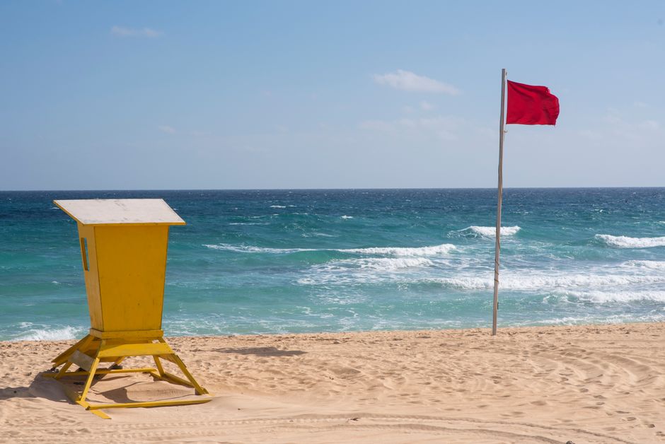 Warning sign representing red flags to check before buying a PLR bundle